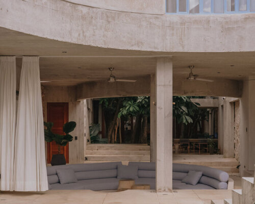 mexican house by ludwig godefroy unfolds as a porous concrete shell around lush courtyards