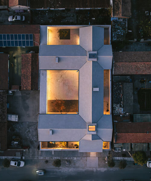 four interwoven gabled wings outline chaoffice's house of cross in beijing